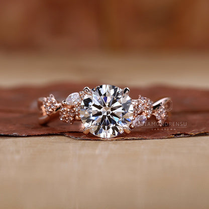 Close-up of a round brilliant cut diamond ring with sidestone engagement ring design