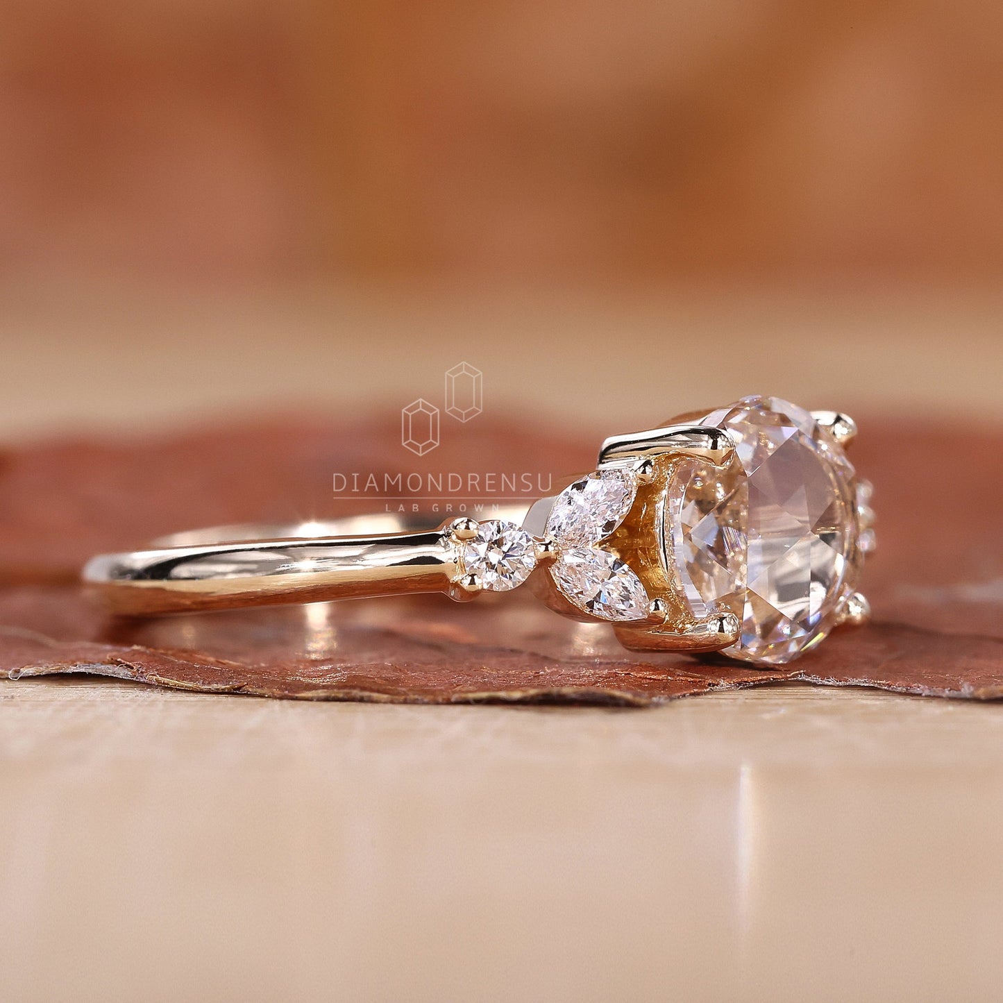 A rose cut diamond ring with rounded prongs securing the diamond in place.