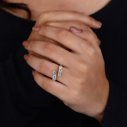 Close-up of a round brilliant cut diamond ring on a hand, emphasizing its exquisite craftsmanship