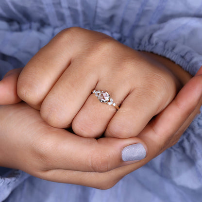 A detailed view of marquise and round side stones on a stunning engagement ring.