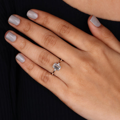 Fashion model showcasing a lab grown emerald cut diamond ring at an evening event