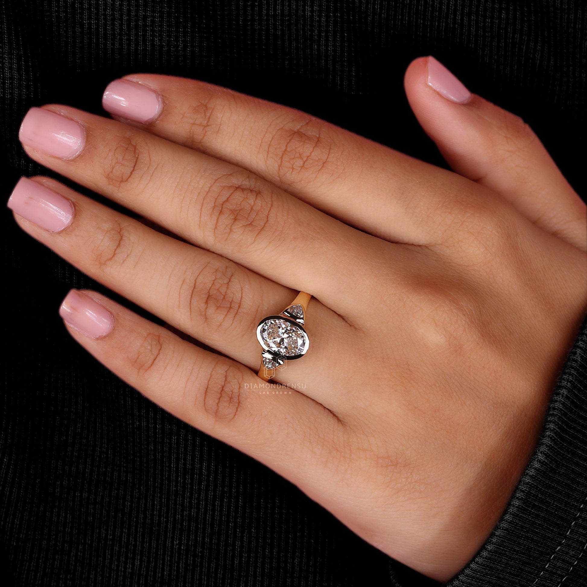 A side view of a luxurious 2 carat oval diamond ring, showcasing its impressive size and timeless appeal.