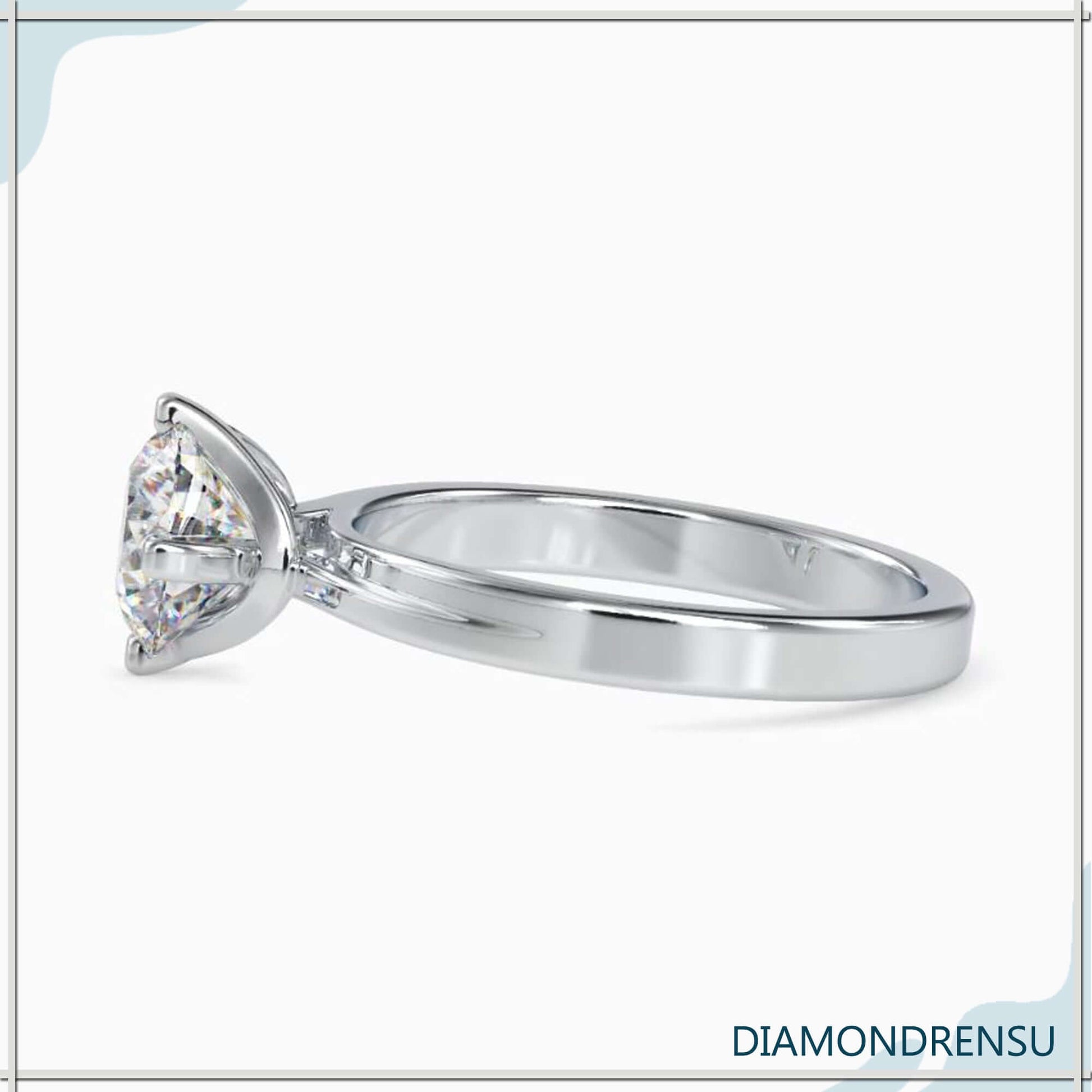 2 carat round cut diamond ring in an elegant solitaire design.
