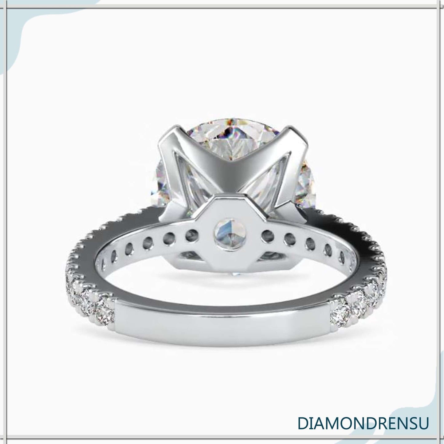 Pave diamond engagement ring with a stunning round cut diamond centerpiece.
