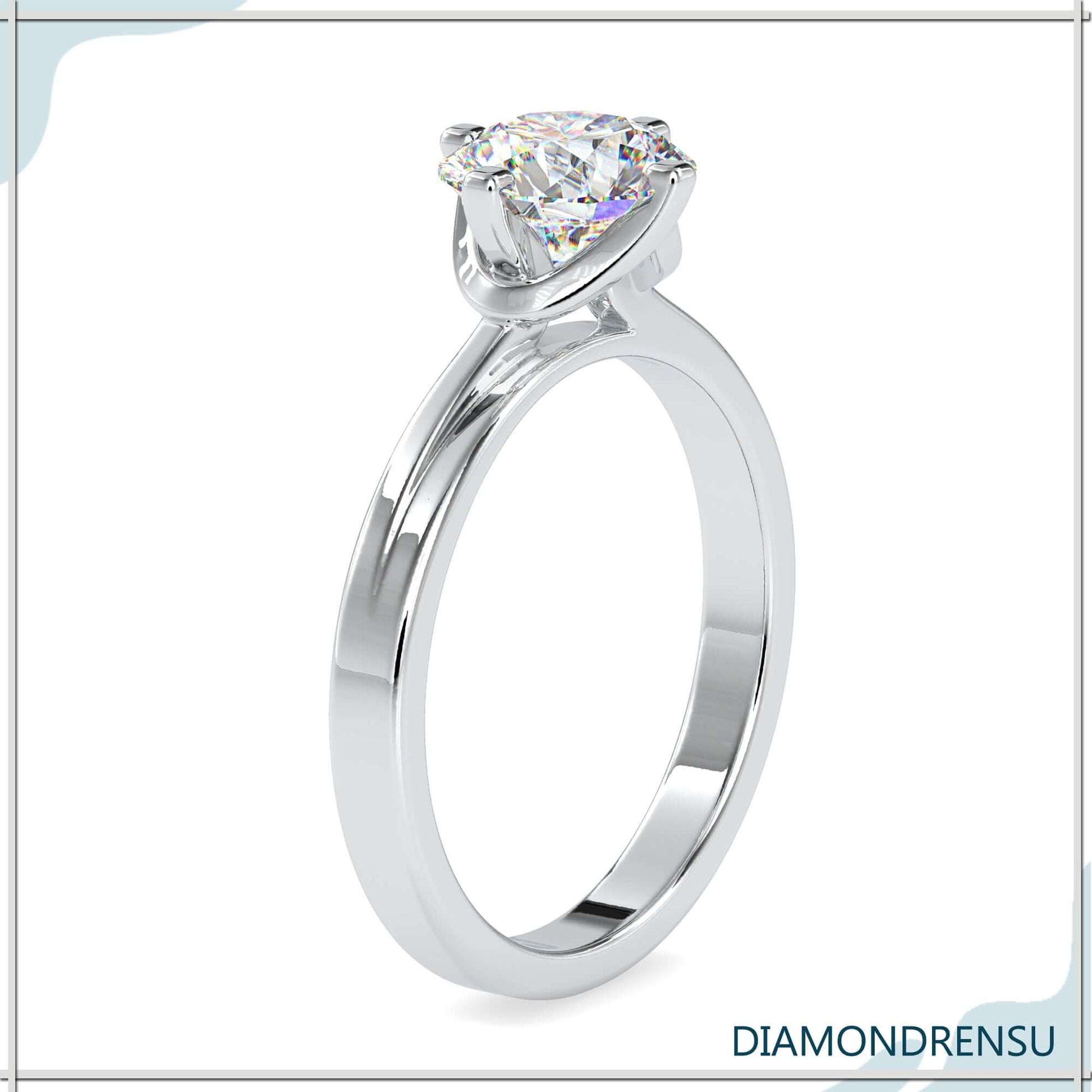 Round cut diamond ring with a timeless 4 prong setting.
