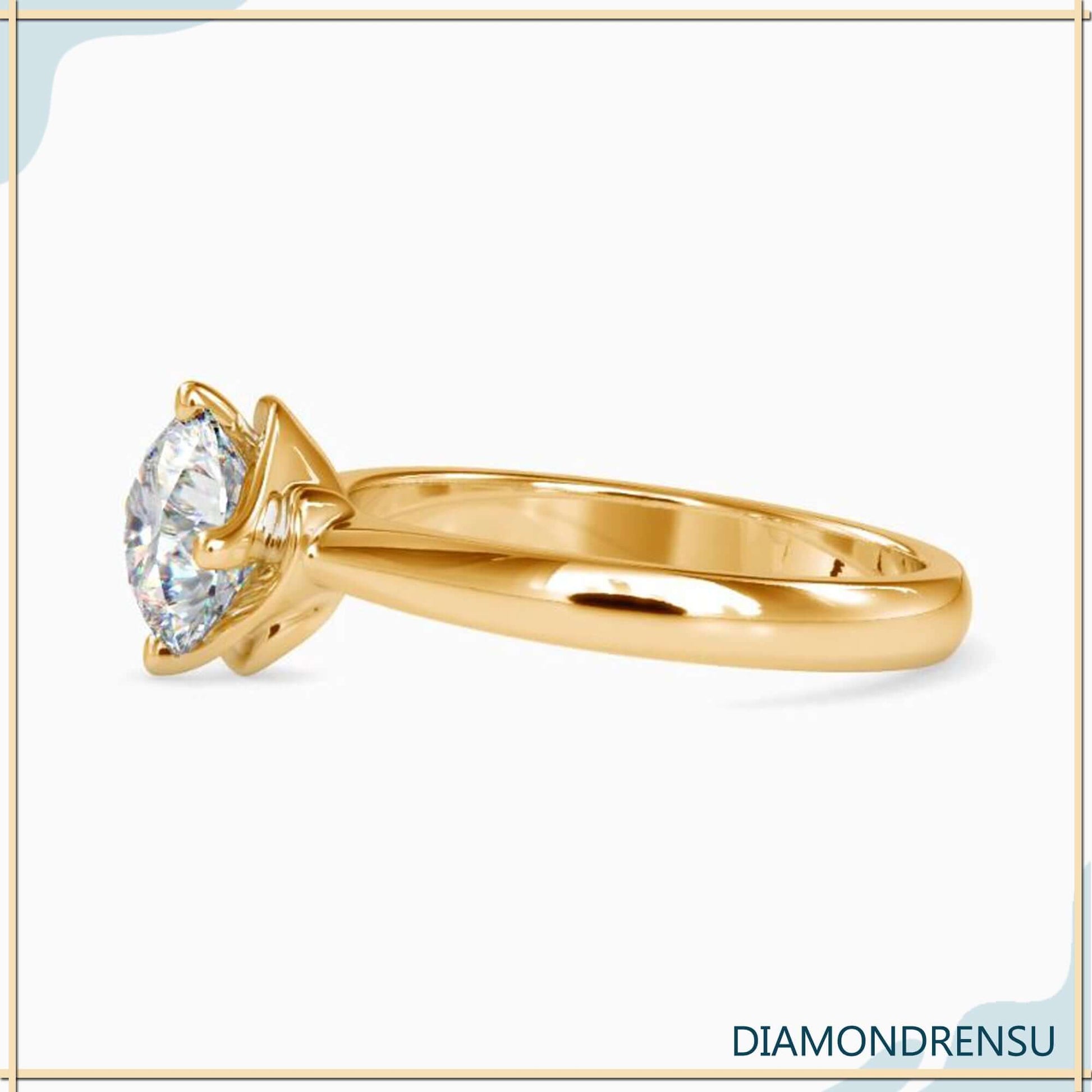 Prong setting diamond solitaire ring round for a timeless look.