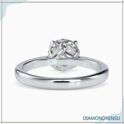 Twisted prong solitaire ring featuring a round solitaire for a perfect engagement.