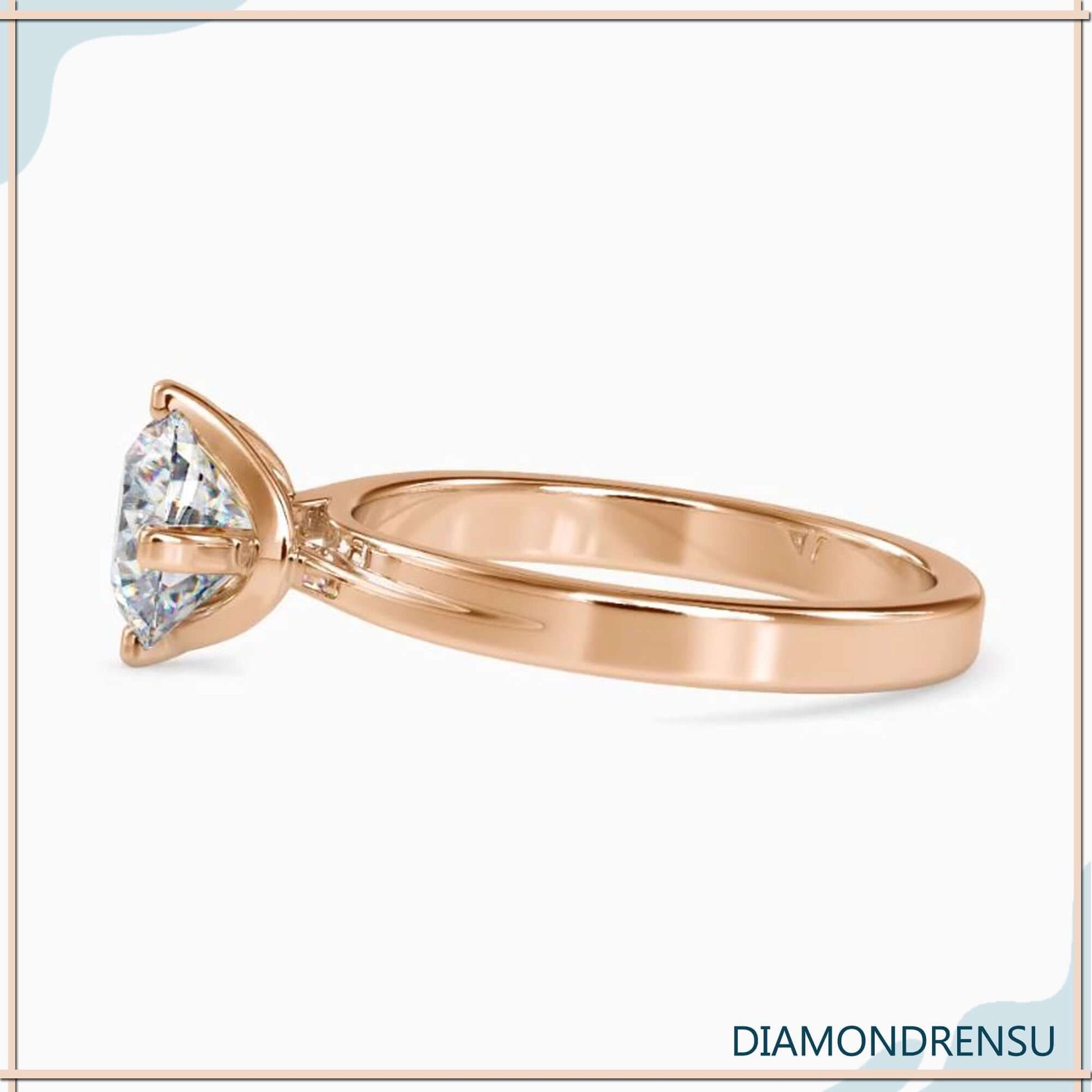 Round solitaire engagement ring with a timeless, elegant design.
