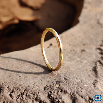 Handmade jewelry featuring a beautiful yellow gold wedding ring.