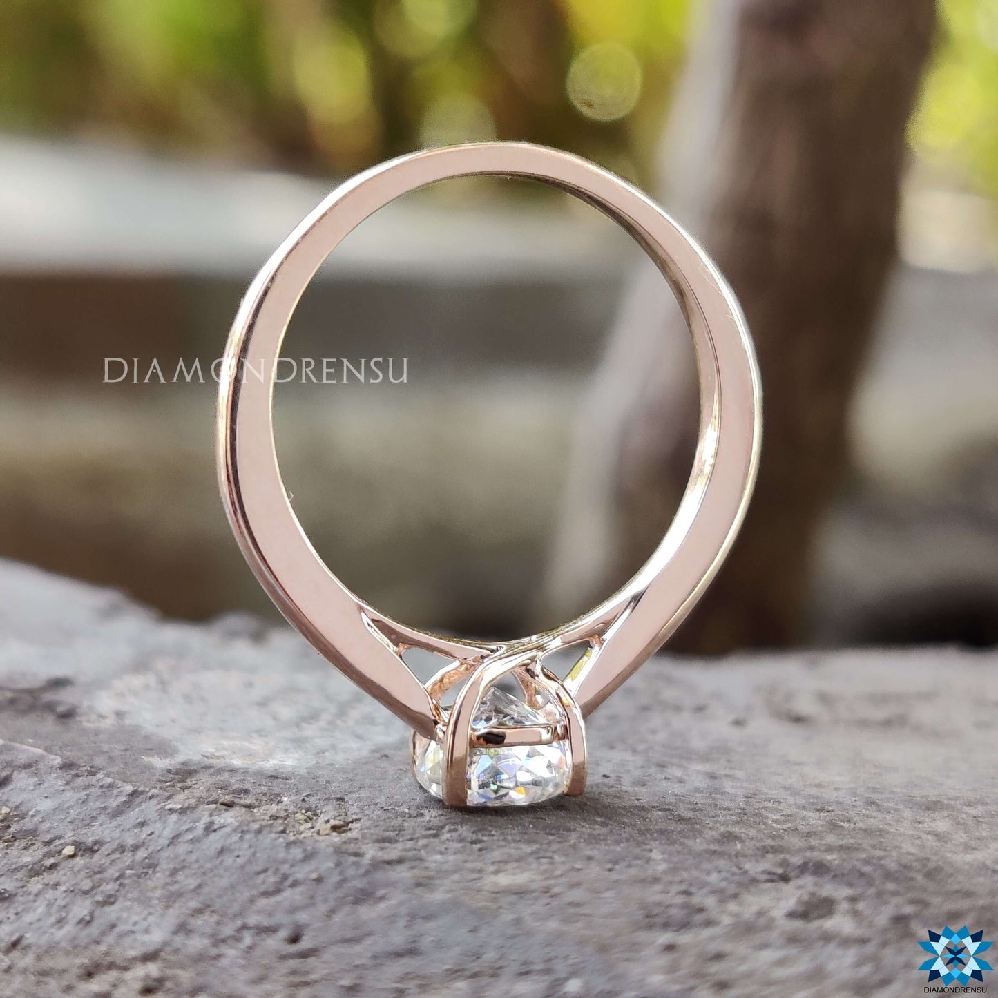 Portuguese cut moissanite ring with an exquisite rose gold engagement ring band and intricate trellis setting ring.