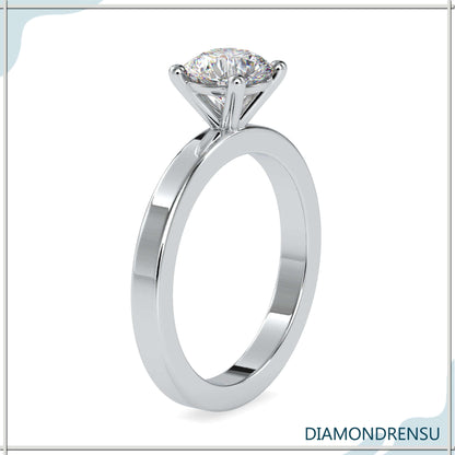 Handcrafted handmade ring with a round solitaire diamond in a basket setting.