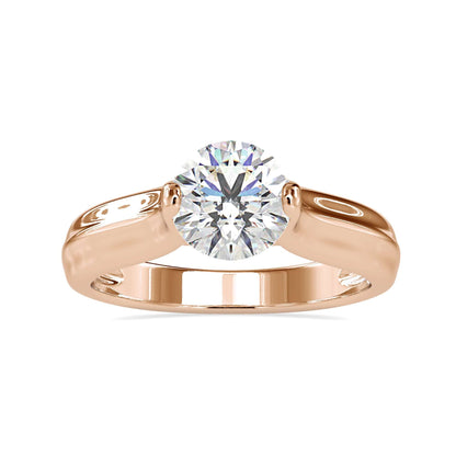 Round solitaire diamond engagement ring, tension set for elegance.