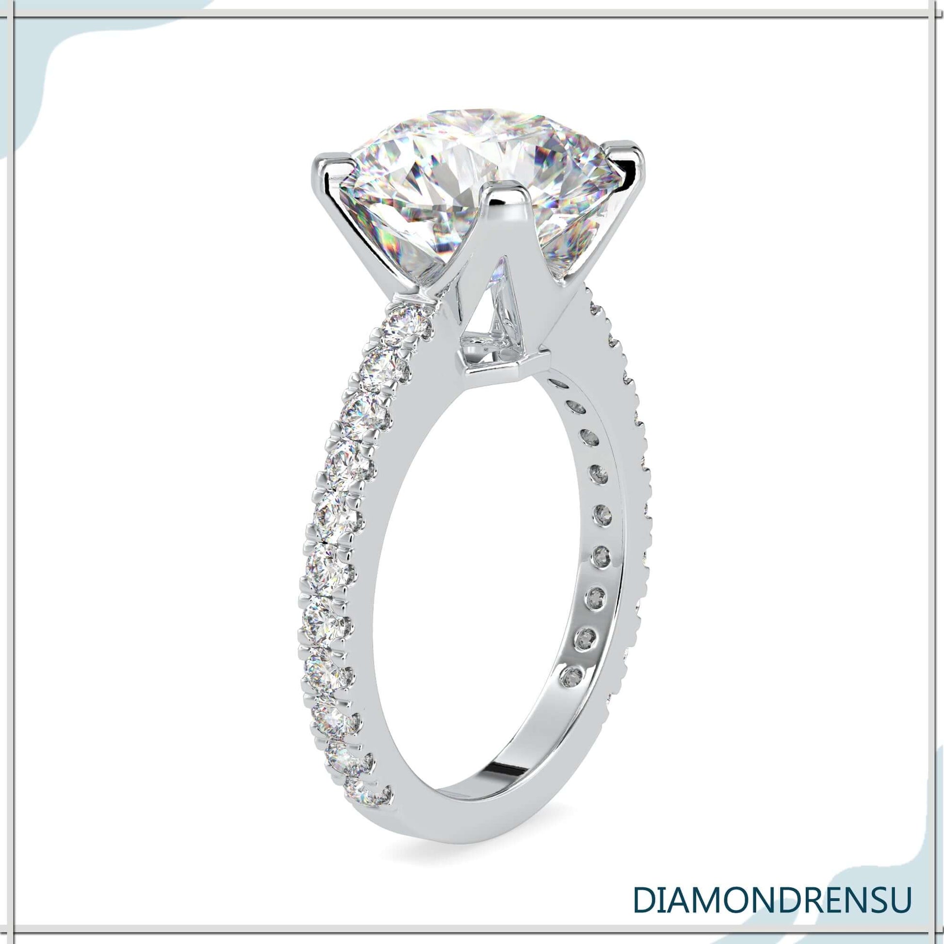 Round brilliant cut diamond ring with a 4 prong engagement ring design.
