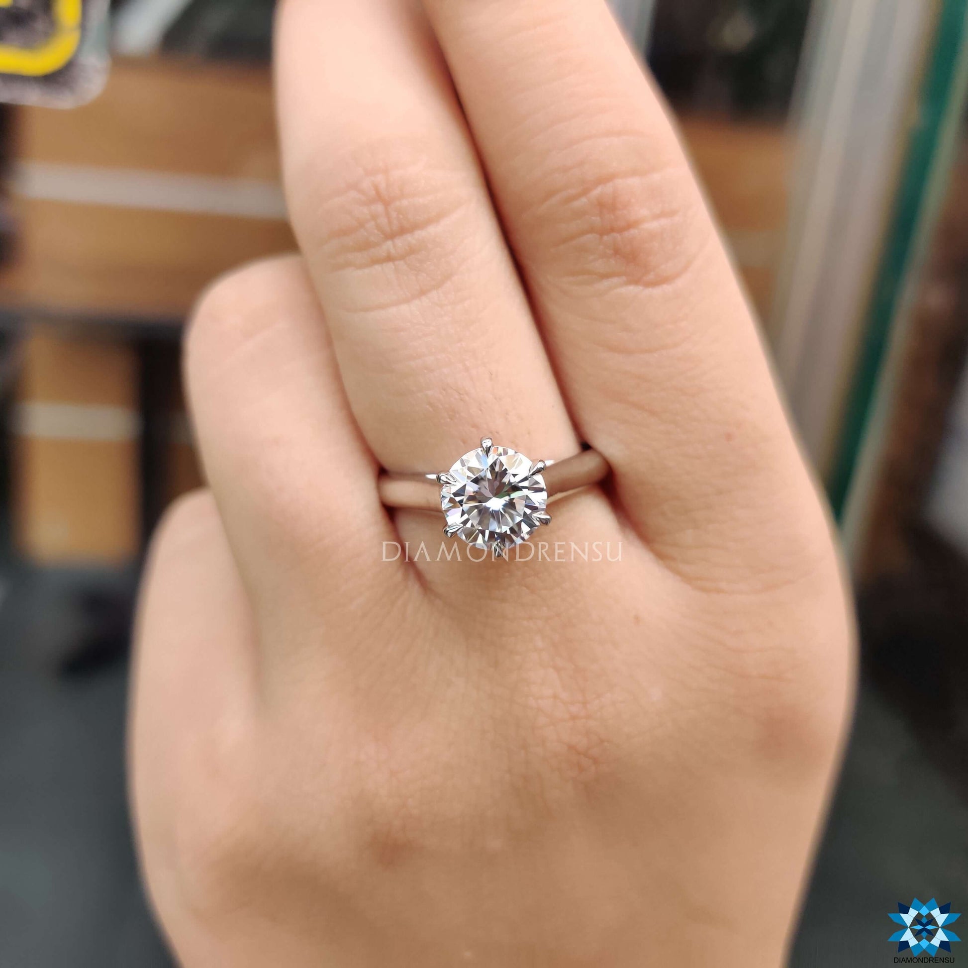 Exquisite round moissanite ring set in a minimalist design for understated elegance.
