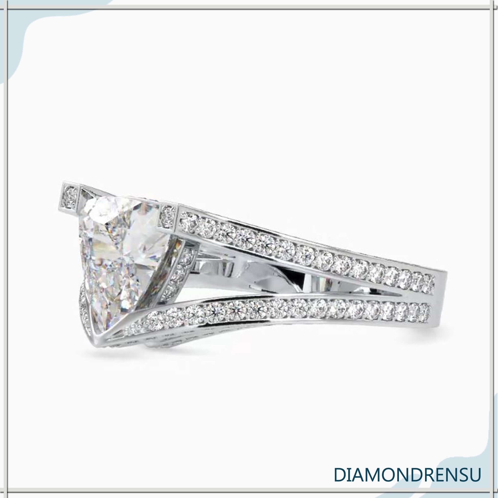 Split shank engagement ring with a trillion diamond and halo setting.