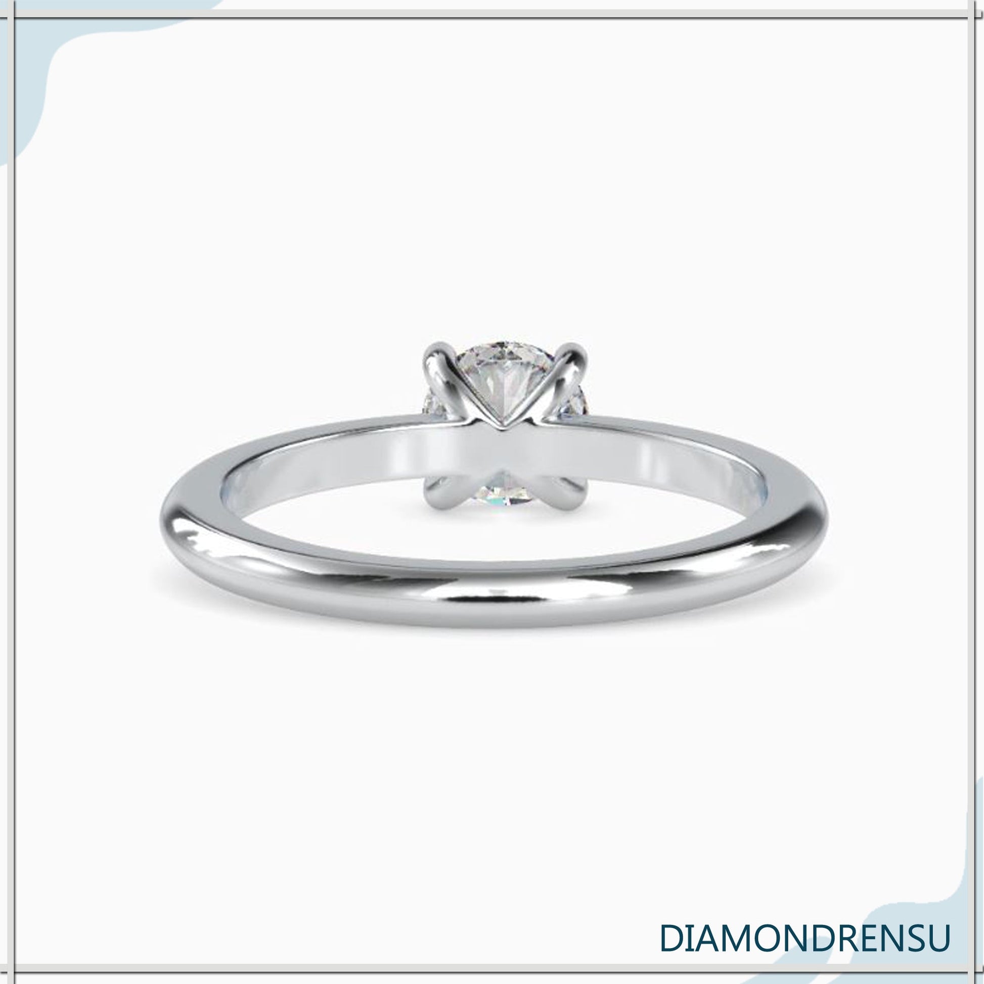 Modern white gold engagement ring featuring a lab grown round diamond.