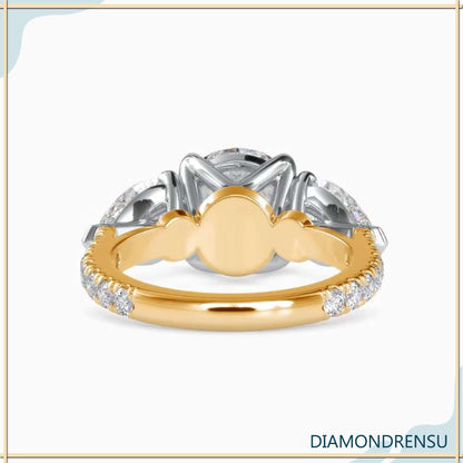 Lab grown diamond ring with a unique pear shape and side stones,