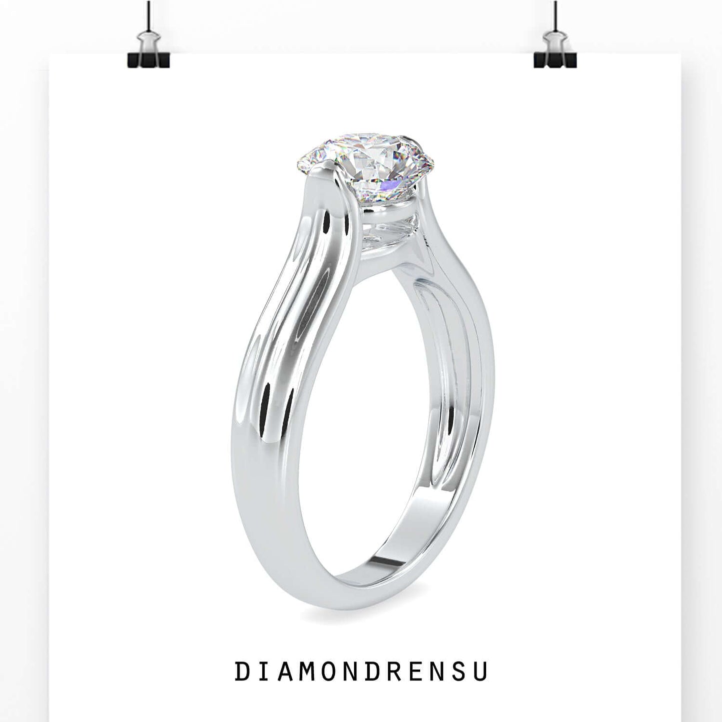 Round solitaire engagement ring in tension setting design.