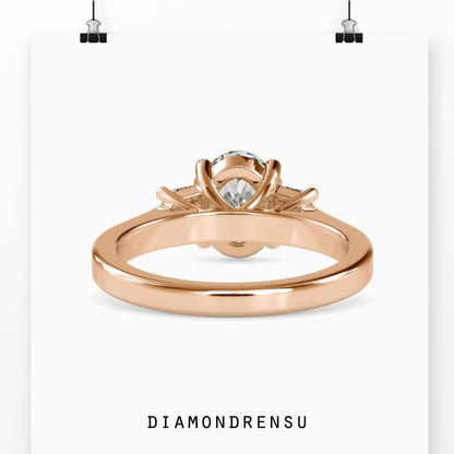 Basket setting diamond ring with trapezoid side stones.