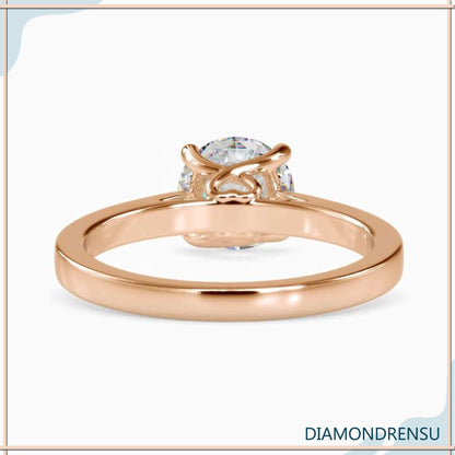 Handmade diamondrensu engagement ring in a stunning round solitaire design.