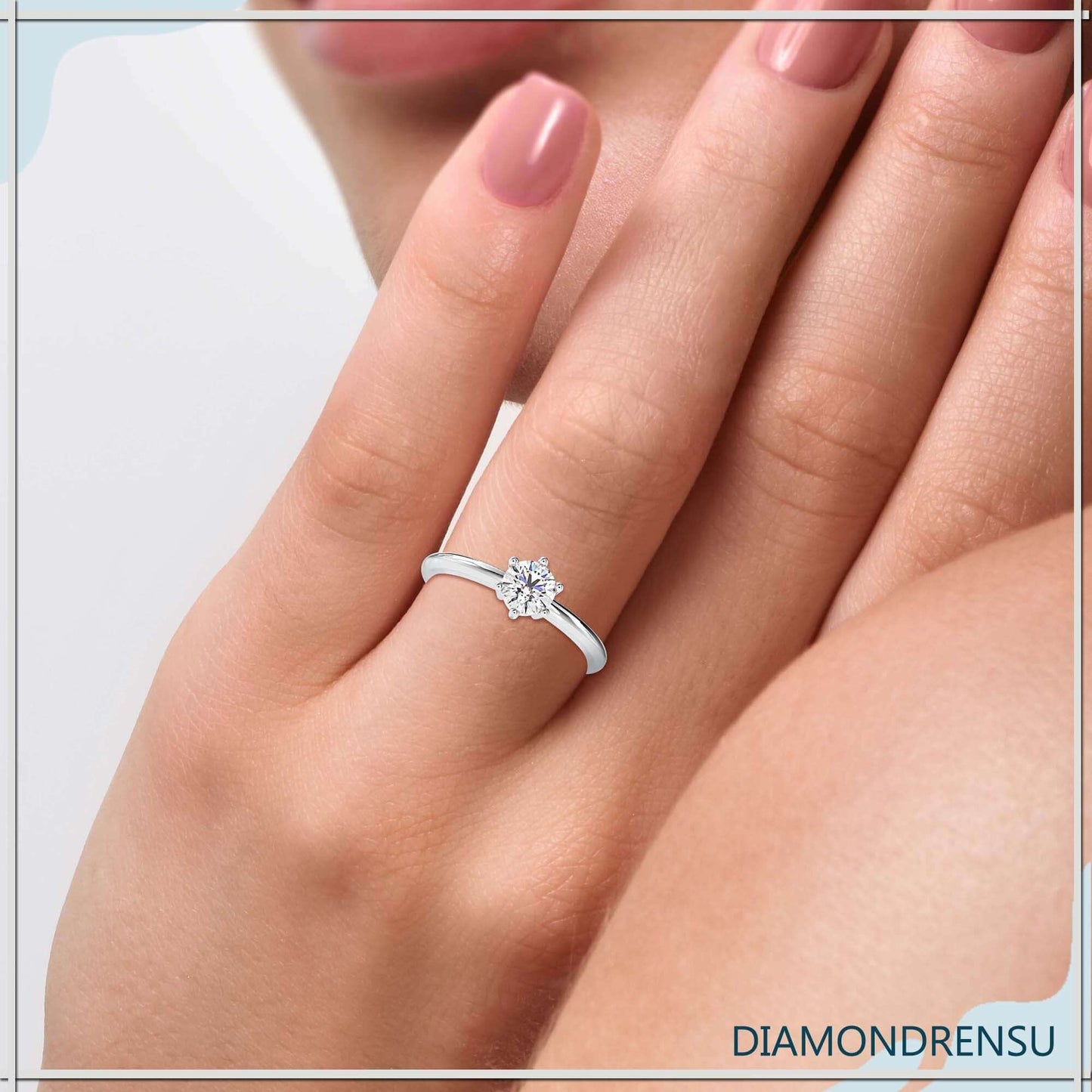 Classic six prong solitaire engagement ring crafted in white gold.