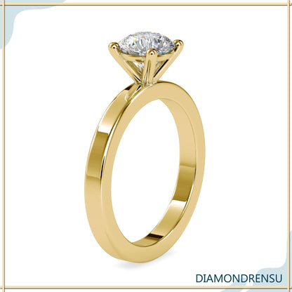 Round lab grown diamond engagement ring with a delicate basket setting.