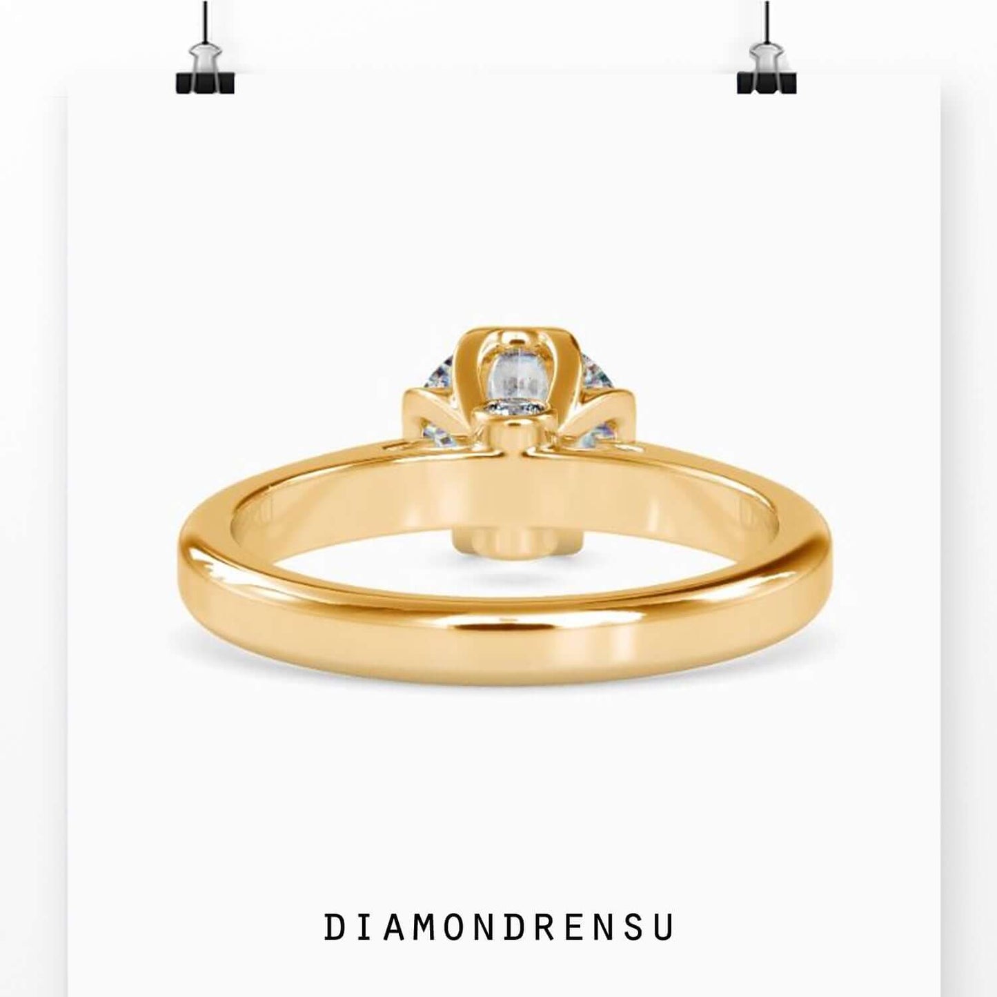 gold round engagement ring featuring lab-grown diamond.