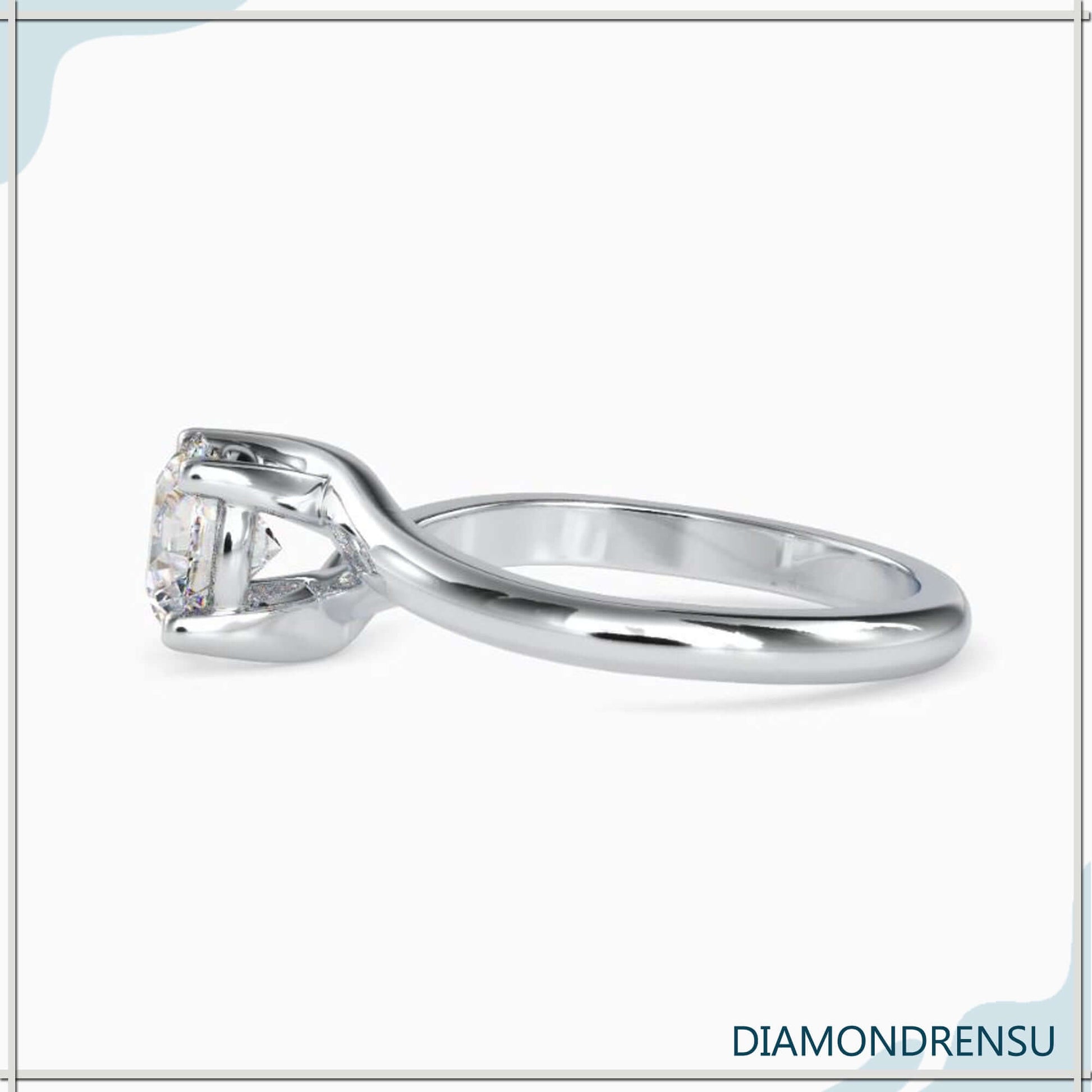 Modern bypass setting ring with an IGI certified round brilliant cut diamond.