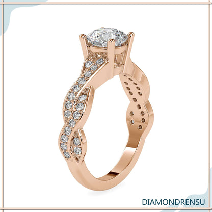 Timeless gold and silver twist ring with a round diamond in a prong setting.
